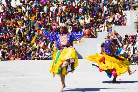 Bhutan, Thimphu Dzong, Dancers in traditional Buddhist costume for the Tsecchu, or Masked Dance. .