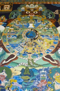 Bhutan, Punakha, Punakha Dzong, Tibetan Buddhist Wheel of Life painted on wall outside main temple.