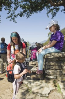 Nepal, Himalayas, Pokhara, Western family with children resting during trek in Nepali Himalayan