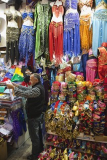 Turkey, Istanbul, Fatih, Sultanahmet, Kapalicarsi, Stall selling traditional clothing in the Grand