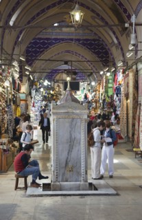 Turkey, Istanbul, Fatih, Sultanahmet, Kapalicarsi, Man washing his feet in the Grand Bazaar.