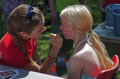 Canada, Alberta, Lethbridge, A bare-shouldered young blonde Canadian girl sits to have the word