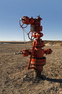 Canada, Alberta, Del Bonita, Christmas tree atop a capped off oil well on the edge of the Bakken