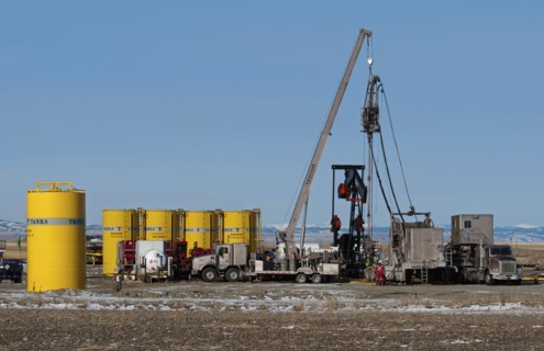 Canada, Alberta, Granum, Argosy Energy Inc fracking for tight shale oil in a wheat field at the
