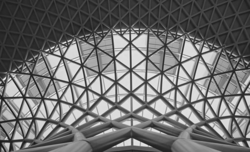 England, London, B&W shot of the metal structure inside Kings Cross Railway Station. 
Photo