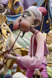 Spain, Valencia Province, Valencia, Papier Mache figure in the street during Las Fallas festival.