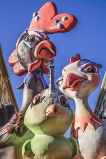 Spain, Valencia Province, Valencia, Papier Mache figures in the street during Las Fallas festival.