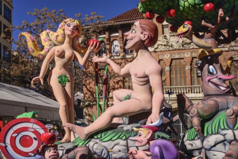 Spain, Valencia Province, Valencia, Papier Mache figures of Adam and Eve in the garden during Las