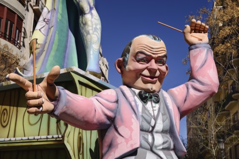 Spain, Valencia Province, Valencia, Papier Mache figure of a man in a pink jacket in the street