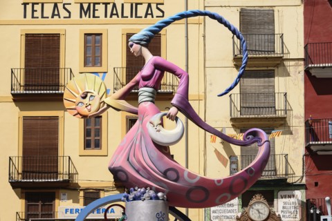 Spain, Valencia Province, Valencia, Papier Mache figure of a lady in a pink dress holding a replica