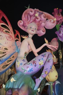 Spain, Valencia Province, Valencia, Papier Mache figure in the street at night during Las Fallas