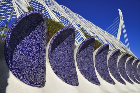 Spain, Valencia Province, Valencia, La Ciudad de las Artes y las Ciencias  City of Arts and Sciences  Arches of the Umbracle sculpture garden with El Pont de lAssut de lOr bridge in the background.