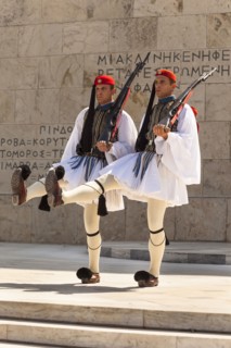 Greece, Attica, Athens, Greek soldiers, Evzones, marching beside Tomb of the Unknown Soldier,