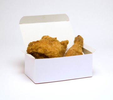 Food, Cooked, Poultry, Battered chicken breast fillet and drumstick in a cardboard box on a white background.