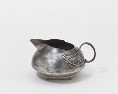 Pewter Tudric Milk Jug, by Archibald Knox. London, England, early 20th century