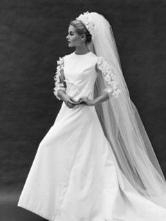 Bride in a wedding dress with a train and veil, photo John French. London, England, 20th century.