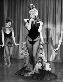 Film still of Jayne Mansfield on stage in The Sheriff of Fractured Jaw
