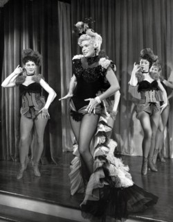 Film still of Jayne Mansfield on stage in The Sheriff of Fractured Jaw